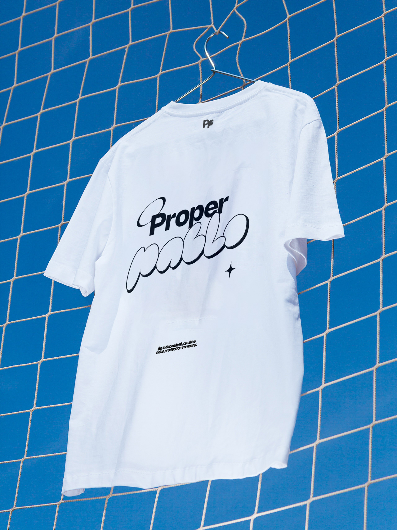 Graphic of a typography specimen showing the alphabet and numerals on top of a dark gray background.