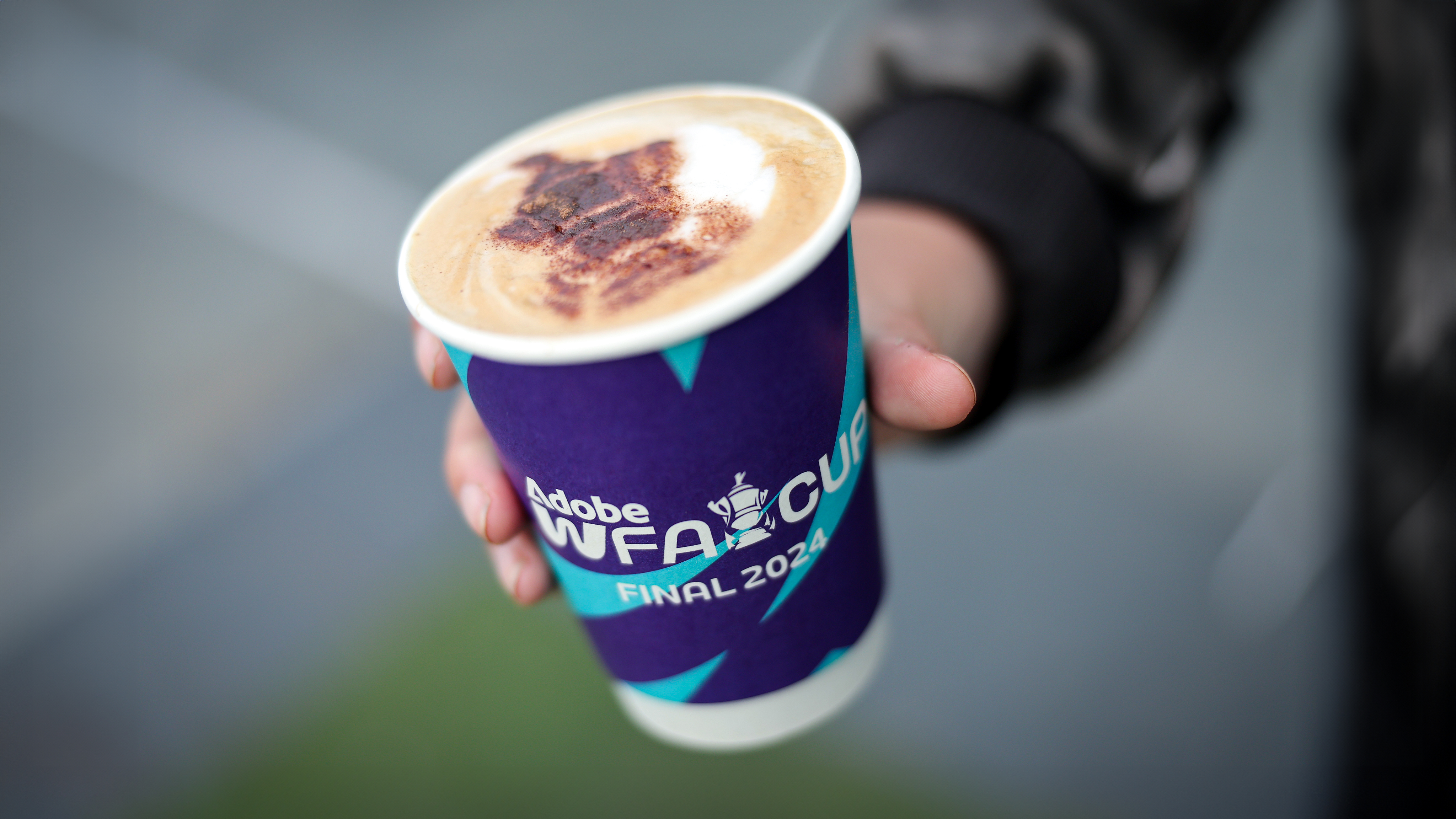 Graphic of a typography specimen showing the alphabet and numerals on top of a dark gray background.